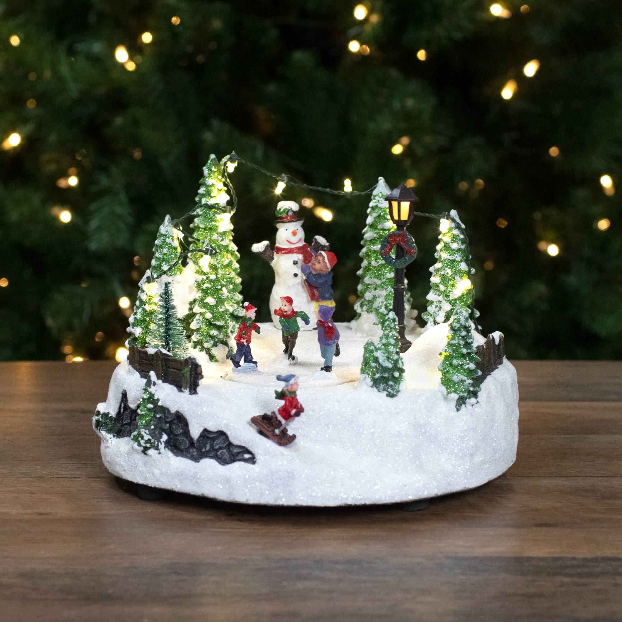 9" Lighted Christmas Scene with Moving Skaters & Snowman